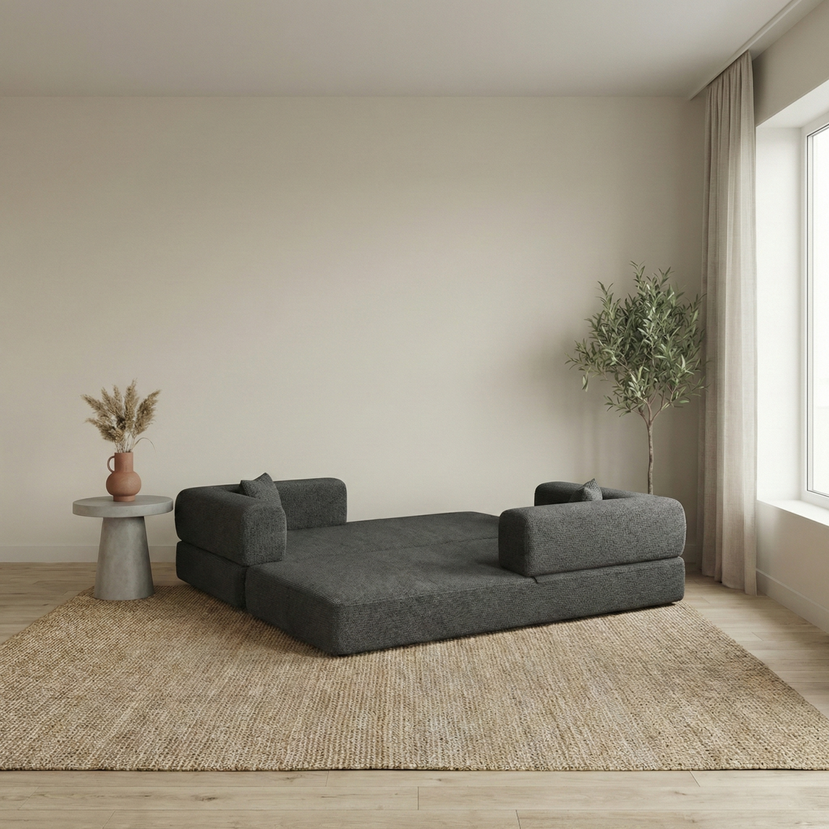 Slaapbank Lugano in donkergrijs als loungebank in een lichte woonkamer