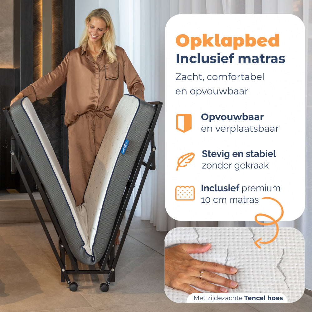 Vrouw klapt Vouwbed Yarra met matras open, opvouwbaar en verplaatsbaar